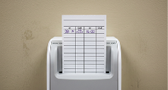 Employee time card in time clock machine