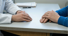 Attorney and client sitting across from each other during consultation
